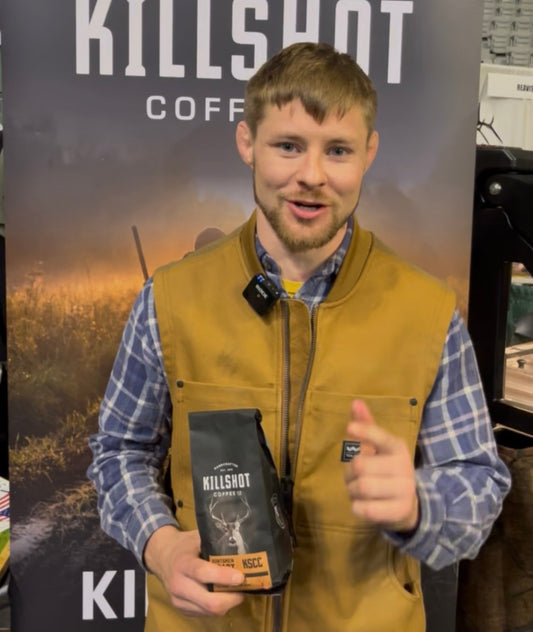 Hunter comparing coffee and an energy drink before a hunt, showing which provides cleaner, steadier energy in the field.